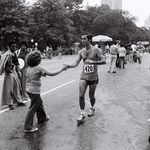 Mary Engel, daughter of marathon photographer Ruth Orkin, hands water to a runner at the 1974 race. (Ruth Orkin/<a href="http://www.orkinphoto.com/">Ruth Orkin Photo Archive</a>)